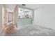 View of the living area and eat-in kitchen, ready for your personal touch at 8419 Laurelon Pl, Temple Terrace, FL 33637