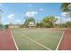 Enjoy a game of tennis on this well-maintained community court with beautiful tree-lined surroundings at 8419 Laurelon Pl, Temple Terrace, FL 33637