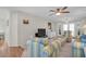 Spacious living room featuring a comfortable seating arrangement and a view of the dining room at 908 Rosewood Ln, Palm Harbor, FL 34684