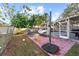 This backyard features a screened-in pool, playful patio area, and ample space for relaxation and outdoor games at 910 Edgedale Cir, Brandon, FL 33510