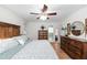 Spacious bedroom boasting hardwood floors, generous closet space, and an ensuite bathroom with an ensuite bathroom at 910 Edgedale Cir, Brandon, FL 33510
