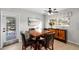 Cozy dining area with a wooden table set, natural light, and stylish decor at 910 Edgedale Cir, Brandon, FL 33510