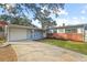 Charming single-story home with brick accents, light blue siding, and a well-maintained front yard at 910 Edgedale Cir, Brandon, FL 33510