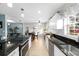 Modern kitchen featuring stainless steel appliances, granite counters, and ample cabinet space at 910 Edgedale Cir, Brandon, FL 33510