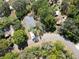 Aerial view of a neighborhood featuring houses, trees, streets and green space at 9445 Eldridge Rd, Spring Hill, FL 34608
