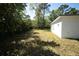 Lush backyard with vibrant green grass and shaded areas, perfect for relaxation and recreation at 9445 Eldridge Rd, Spring Hill, FL 34608