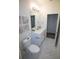 A full bathroom featuring marble-look tile, a white vanity, and modern fixtures at 9445 Eldridge Rd, Spring Hill, FL 34608