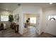 Inviting foyer leading to a bright office with glass doors and a comfortable living space at 9445 Eldridge Rd, Spring Hill, FL 34608