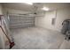 Spacious two-car garage featuring ample room for parking and storage, with a water heater at 9445 Eldridge Rd, Spring Hill, FL 34608