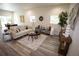 Comfortable living room with neutral tones, stylish furniture, and ample natural light at 9445 Eldridge Rd, Spring Hill, FL 34608