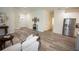 Spacious living area with modern decor, seamlessly connecting to the kitchen and entryway at 9445 Eldridge Rd, Spring Hill, FL 34608