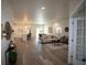 Bright, open-concept living space with stylish furnishings and hardwood floors at 9445 Eldridge Rd, Spring Hill, FL 34608