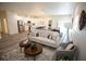 Spacious open-concept living area with kitchen island, dining space, and comfortable seating at 9445 Eldridge Rd, Spring Hill, FL 34608