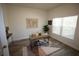 Bright home office with a modern desk, stylish decor, and a large window at 9445 Eldridge Rd, Spring Hill, FL 34608