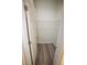 Walk-in closet featuring rod shelving for easy organization and wood-look flooring at 9445 Eldridge Rd, Spring Hill, FL 34608
