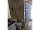 Cozy bathroom featuring a vanity with a dark countertop and a shower with a blue curtain at 9636 Greenbank Dr, Riverview, FL 33569