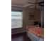 Bedroom featuring a cozy bed and a window with a shade letting in natural light at 9636 Greenbank Dr, Riverview, FL 33569
