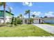 Charming single-story home with a well-manicured lawn and inviting curb appeal, featuring a two car garage at 9826 Island Harbor Dr, Port Richey, FL 34668