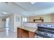 Open kitchen adjacent to the living room with tile floors and granite countertops at 9826 Island Harbor Dr, Port Richey, FL 34668