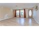 Spacious living room with attractive laminate floors and natural light at 9826 Island Harbor Dr, Port Richey, FL 34668