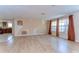 Bright living room featuring wood floors, decorative wall design, and two large windows at 9826 Island Harbor Dr, Port Richey, FL 34668