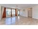 Bright living room featuring stylish laminate floors and a welcoming entrance at 9826 Island Harbor Dr, Port Richey, FL 34668