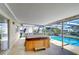 Covered patio with a relaxing hot tub overlooking the sparkling pool at 9826 Island Harbor Dr, Port Richey, FL 34668