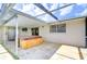Outdoor patio with a hot tub, and access to the home via sliding doors at 9826 Island Harbor Dr, Port Richey, FL 34668