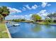 Relaxing scene of waterfront with a canal, with a private dock and lush greenery at 9826 Island Harbor Dr, Port Richey, FL 34668