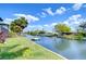 Scenic waterfront view featuring a canal with a private dock and verdant landscape, perfect for boating at 9826 Island Harbor Dr, Port Richey, FL 34668