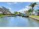Beautiful canal with multiple docks, boat lifts, and well-maintained waterfront properties, ideal for boating enthusiasts at 9826 Island Harbor Dr, Port Richey, FL 34668