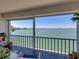 Enjoy the calming water views from this comfortable outdoor balcony with seating at 7910 Sun Island S Dr # 301, South Pasadena, FL 33707
