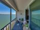 Relaxing condo balcony offers a stunning waterfront view and comfortable seating at 7910 Sun Island S Dr # 301, South Pasadena, FL 33707