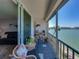 Inviting balcony overlooking the water with chairs and relaxing place to take in the ocean views at 7910 Sun Island S Dr # 301, South Pasadena, FL 33707
