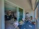 Cozy balcony with waterfront views and access to the living room at 7910 Sun Island S Dr # 301, South Pasadena, FL 33707
