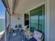 Serene balcony with comfortable seating, potted plants, and tranquil water views at 7910 Sun Island S Dr # 301, South Pasadena, FL 33707