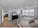 This bright bedroom features hard wood floors, ceiling fan, and a view of the water at 7910 Sun Island S Dr # 301, South Pasadena, FL 33707