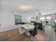 Light-filled dining room featuring modern decor and a view of the nearby balcony and living room at 7910 Sun Island S Dr # 301, South Pasadena, FL 33707