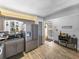 Charming kitchen features wood tile floors, granite countertops, and stainless steel appliances at 7910 Sun Island S Dr # 301, South Pasadena, FL 33707