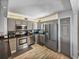 Well-equipped kitchen features stainless steel appliances and sleek granite countertops at 7910 Sun Island S Dr # 301, South Pasadena, FL 33707