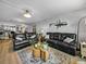 Spacious living room with comfortable seating and stylish decor that flows to the kitchen at 7910 Sun Island S Dr # 301, South Pasadena, FL 33707