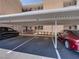 Assigned covered parking, with numbered spots, adjacent to meticulously maintained landscaping at 7910 Sun Island S Dr # 301, South Pasadena, FL 33707