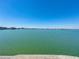 Expansive water view showcasing a calm and serene waterfront, providing a tranquil backdrop for the property at 7910 Sun Island S Dr # 301, South Pasadena, FL 33707