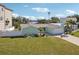 Charming single-story home with a well-maintained lawn and an attached two-car garage at 104 Carlyle Cir, Palm Harbor, FL 34683