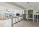 Open kitchen space with an island ready for new appliances and great view of the water at 104 Carlyle Cir, Palm Harbor, FL 34683