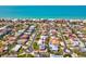 Coastal neighborhood featuring charming homes with manicured lawns and easy access to the beach at 115 16Th St, Belleair Beach, FL 33786