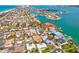 Stunning aerial view showcases waterfront homes with scenic views of bay at 115 16Th St, Belleair Beach, FL 33786