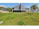 Expansive backyard with lush lawn, perfect for outdoor activities and entertaining at 115 16Th St, Belleair Beach, FL 33786