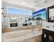 Bathroom features a soaking tub with jets, double mirrors, and a wall-mounted TV above tub at 115 16Th St, Belleair Beach, FL 33786