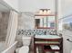 Bathroom with tile walls, glass bowl sink, and a shower-tub combination at 115 16Th St, Belleair Beach, FL 33786